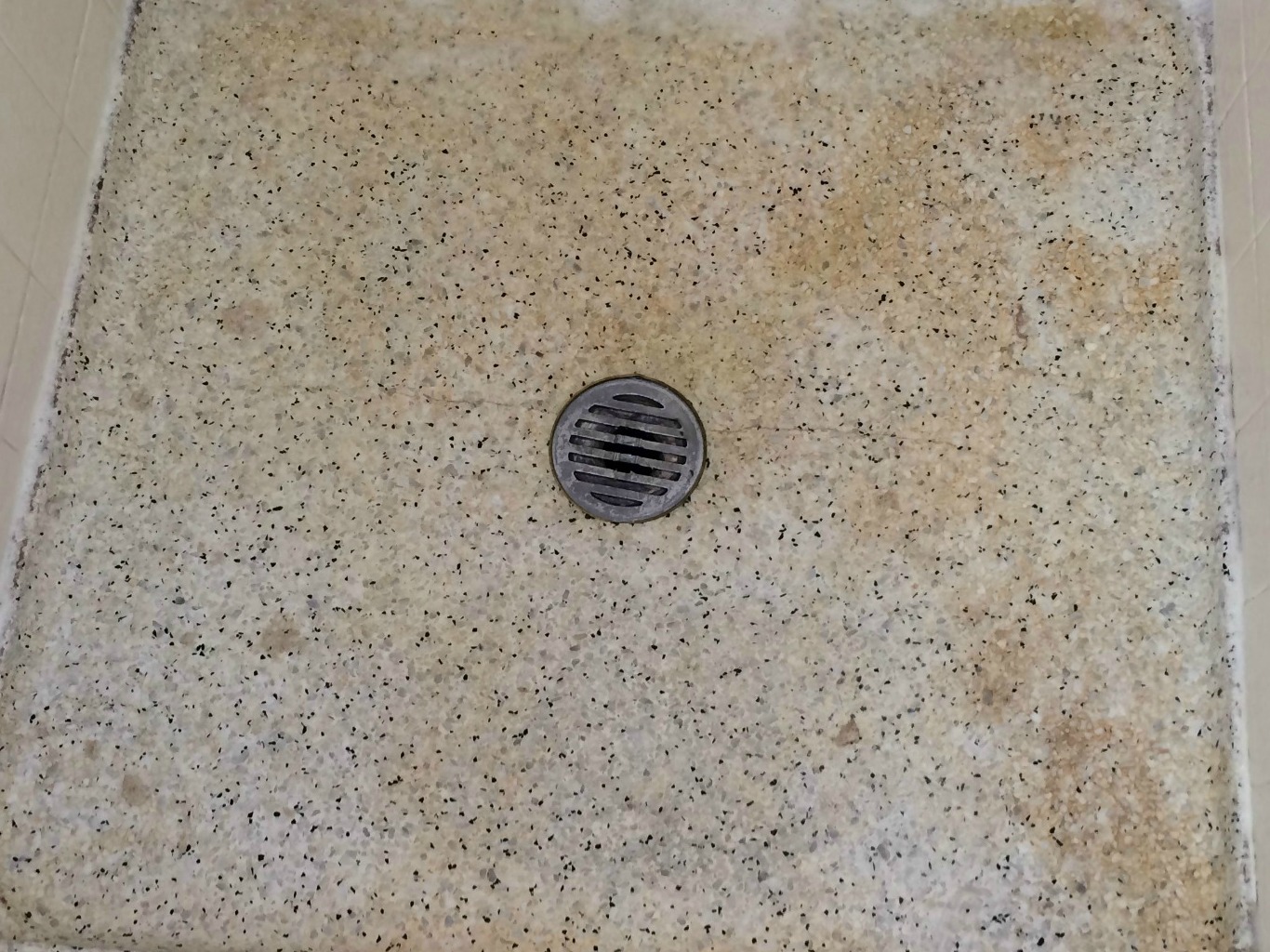 Rust on Shower Floor Removed by Referral